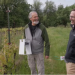 In this video still OSU entomologist Vaughn Walton (right) prepares to install the Pied Piper in May 2023 at the Stag Hollow Winery. Owner Mark Huff (left) holds the device he hopes will eventually help Oregon wineries better control pests.